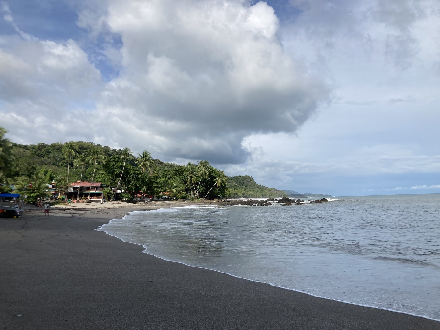 A quiet dark sand cove along the Montezuma coastline