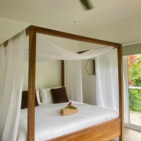 Canopy king bed inside a Serenity Suite